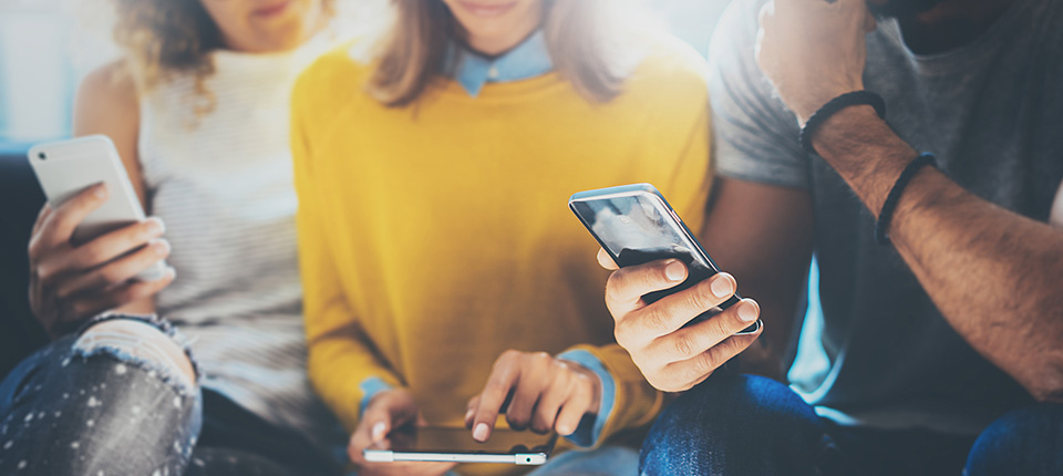 Closeup Group Adult Hipsters Friends Sitting Sofa Using Hands Modern Smartphone Tablet.Business Startup Friendship Teamwork Concept.People Working Together Project.Coworking Process Studio.Blurred; Shutterstock ID 482236333; PO: 123